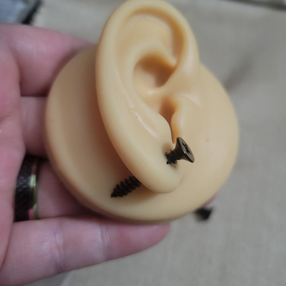 Black screw shaped illusion post earrings
